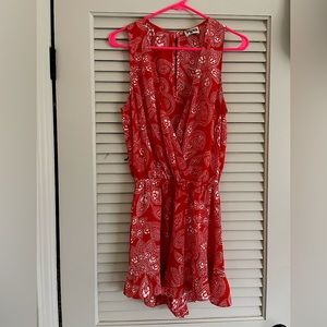 Super cute ruffled short romper. So flattering and lightweight.